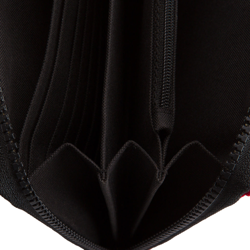 Paguro Upcycle recycled rubber travel organiser pouch interior showing zip pocket and accordion compartments