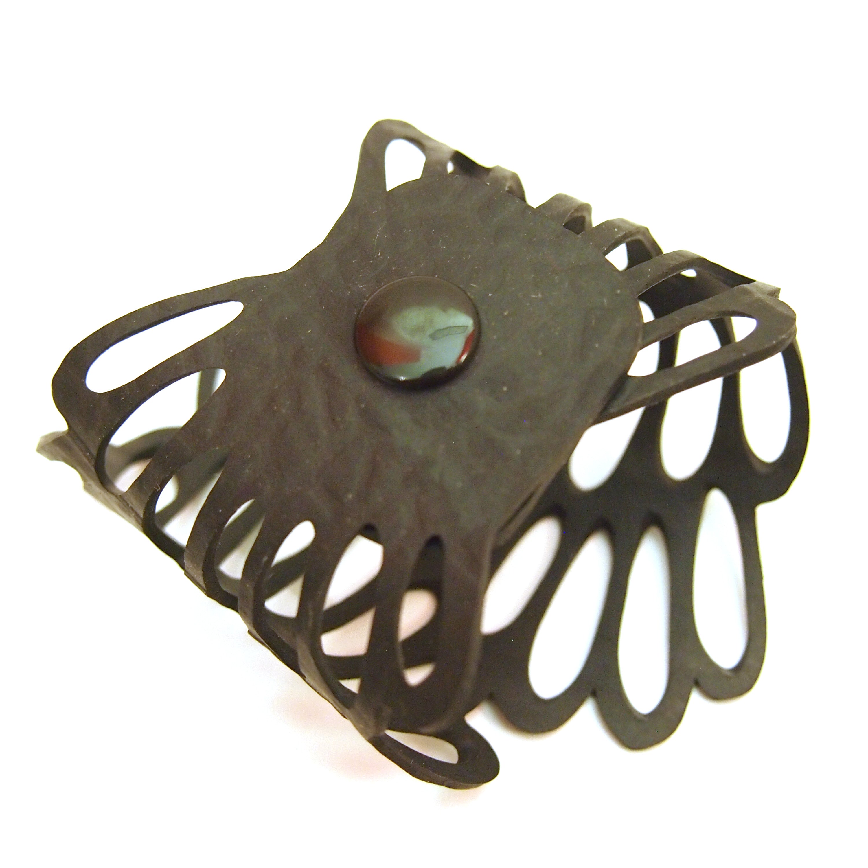 Paguro Upcycle recycled rubber bracelet with black cutout design and central button detail