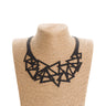 Paguro Upcycle black geometric recycled necklace with interlocking triangle shapes on display bust