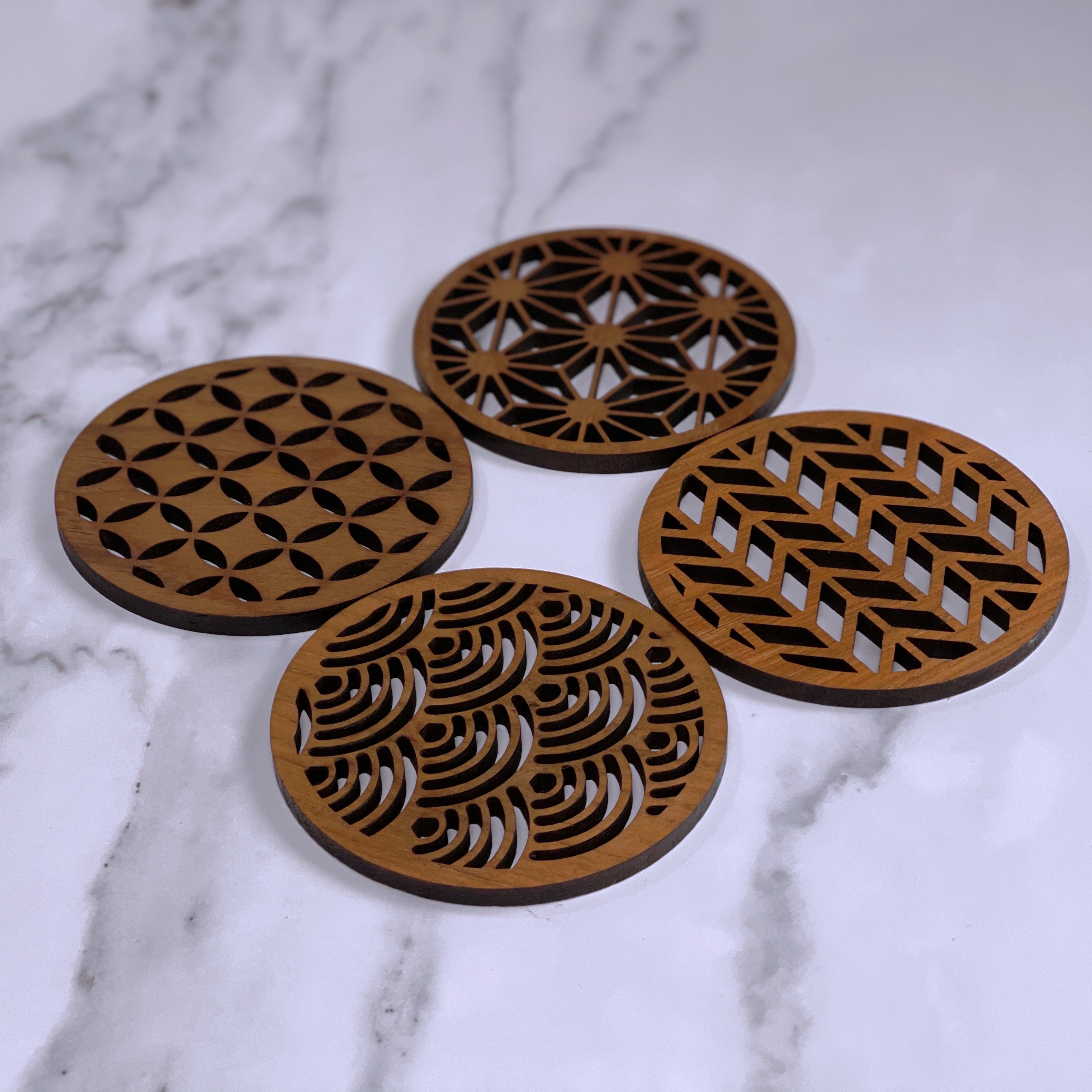 Paguro Upcycle Japanese pattern drink coasters set with intricate geometric designs on wood