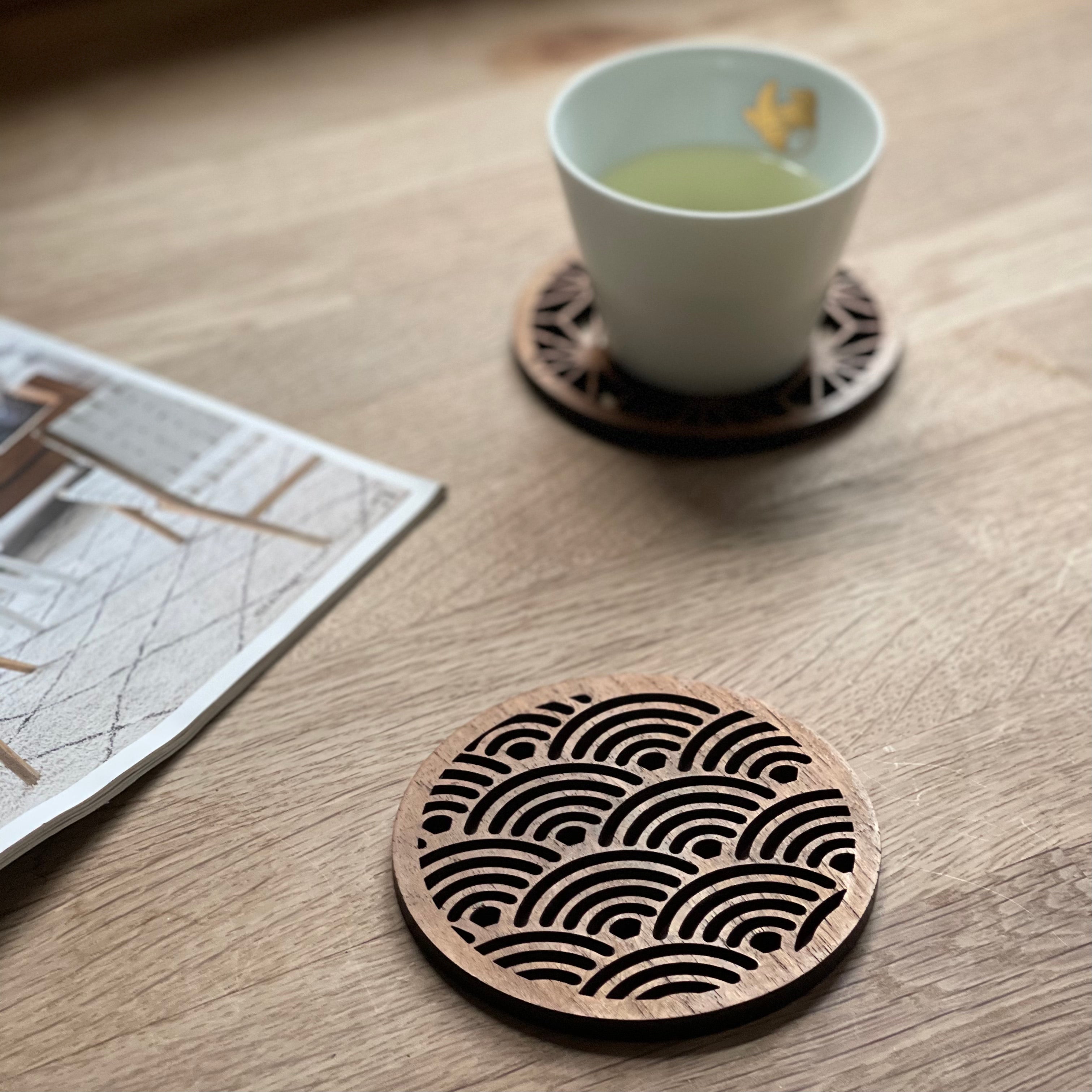 Paguro Upcycle Japanese pattern drink coasters with intricate wave design on wooden surface