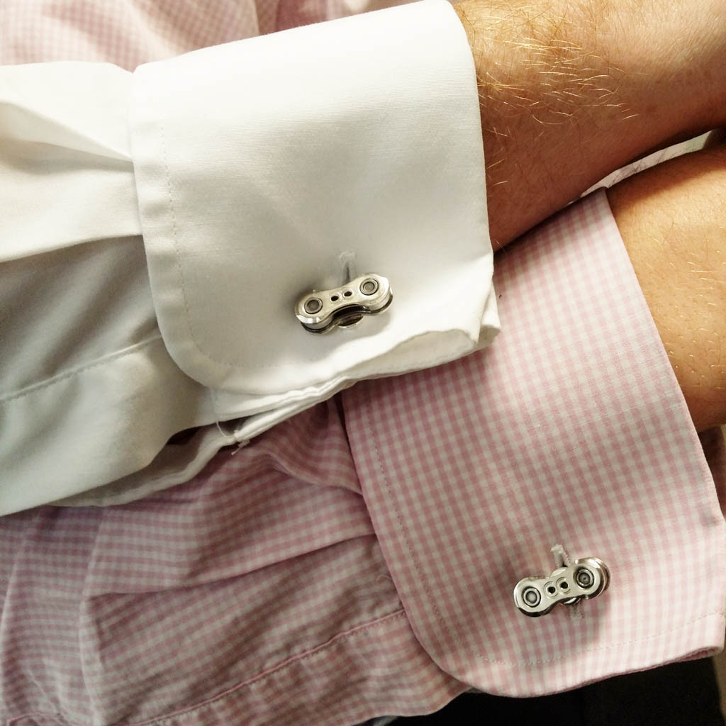 Paguro Upcycle recycled bicycle chain cufflinks worn on white and pink checkered dress shirts