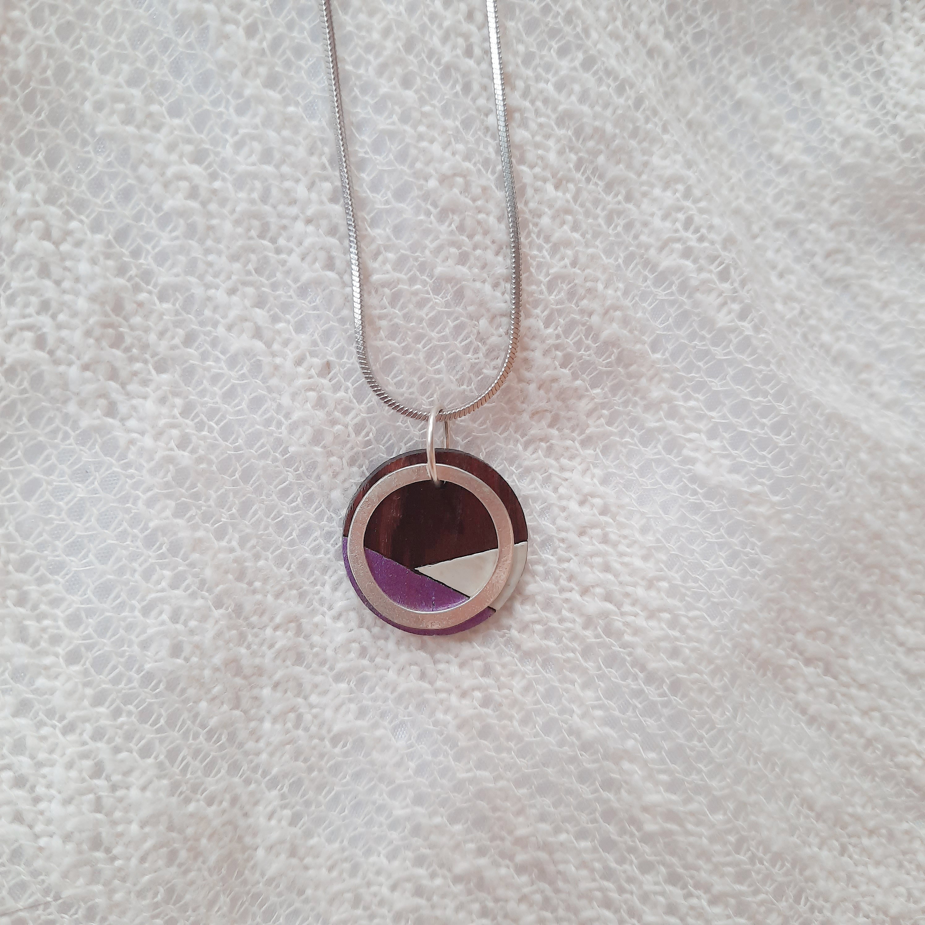 Paguro Upcycle recycled wood silver necklace with geometric circular pendant on silver chain