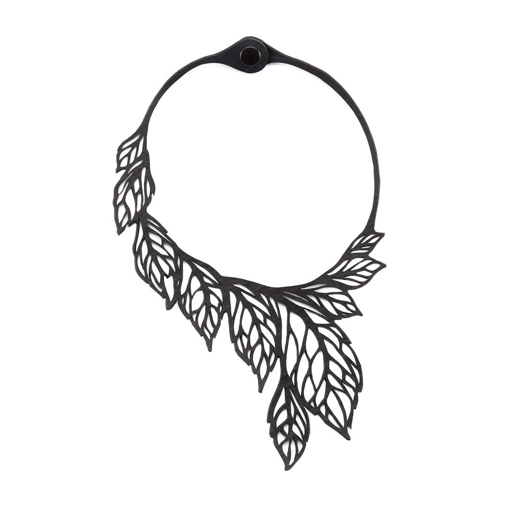 Paguro Upcycle recycled rubber leaf necklace with intricate cutout leaves design in black